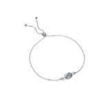 Adjustable bracelet with oval blue topaz