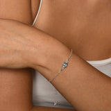 Adjustable bracelet with oval blue topaz