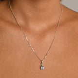 Fine box chain necklace with pear blue topaz