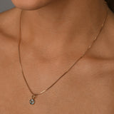 Fine box chain necklace with round blue topaz