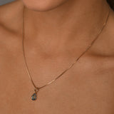 Fine box chain necklace with pear blue topaz
